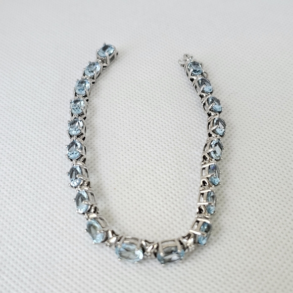 Natural Sky Blue Topaz & Diamond Accent Tennis Bracelet in Sterling Silver! - Picture 2 of 6